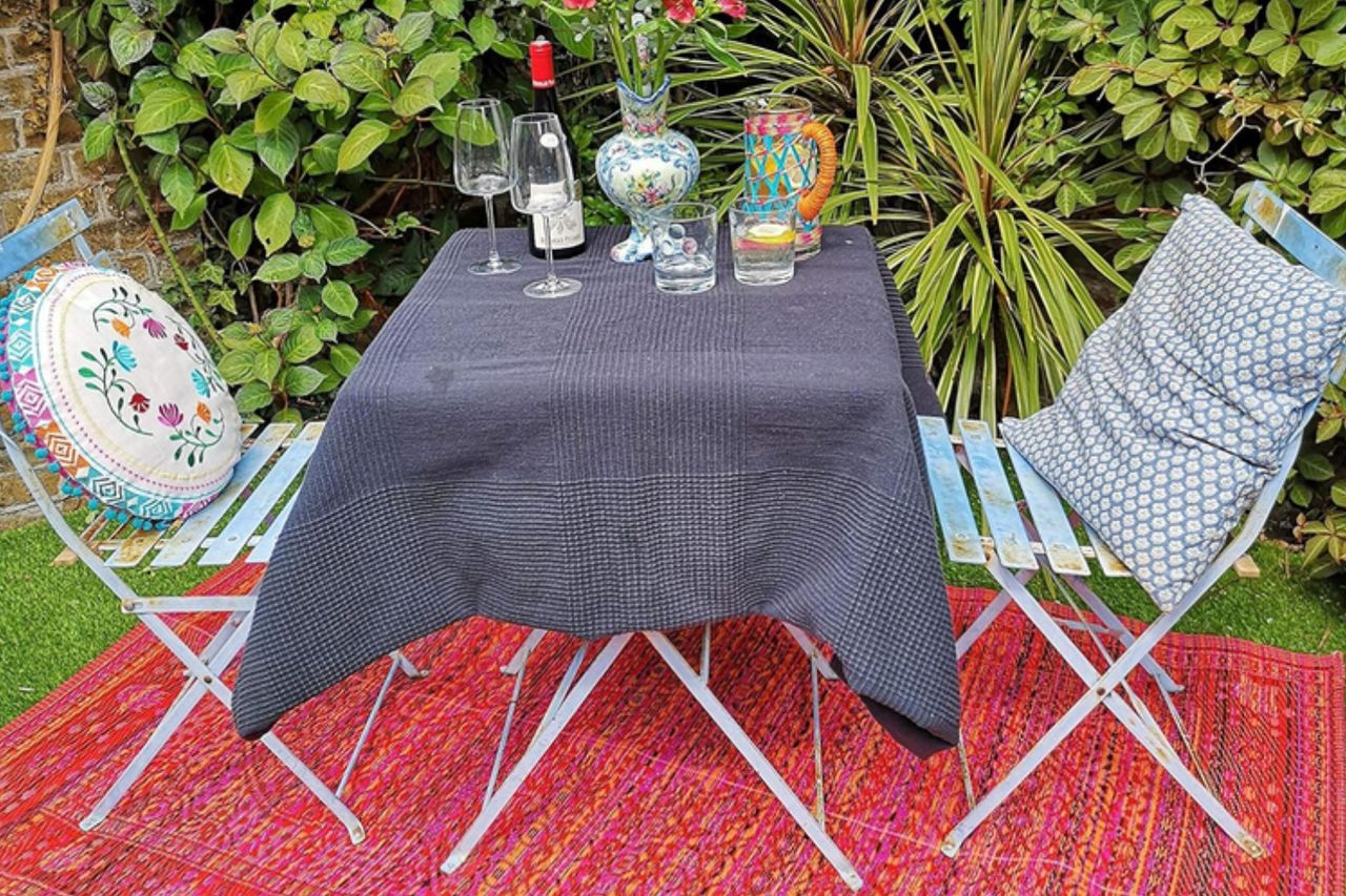 Talking Tables Red Boho Woven Waterproof Outdoor Rug - Plastic, Lightweight & Non Slip Mat - for Garden, Patio, Decking, Bathroom, Utility, Picnic Credit: Amazon
