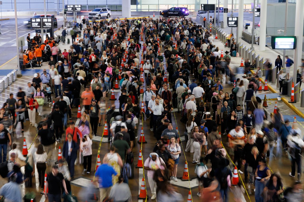 Travelers waiting in line at a TSA checkpoint at George H.W. Bush Intercontinental Airport in Houston on March 26Credit: Mark Felix/Bloomberg via Getty