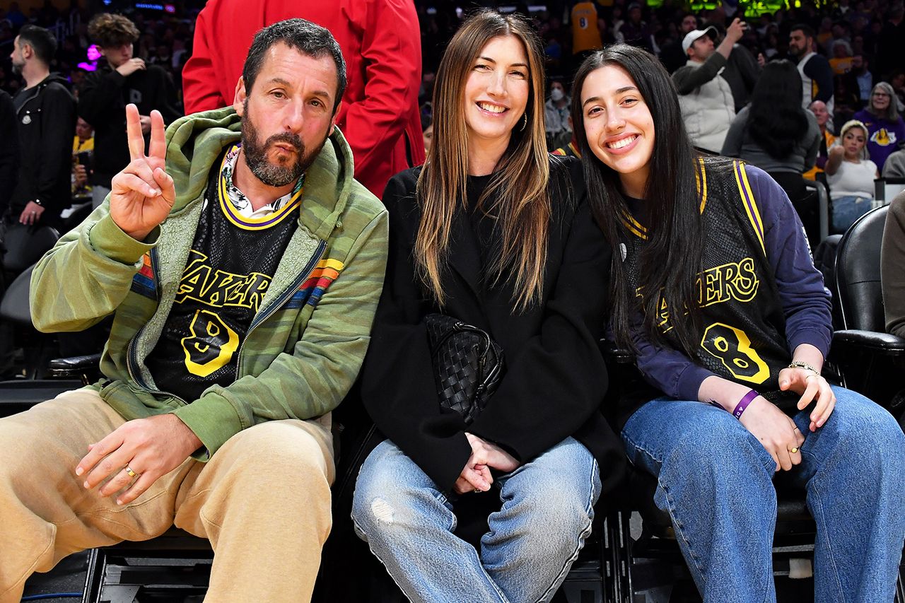Adam Sandler, Jackie Sandler and Sadie Sandler attend a basketball game between the Los Angeles Lakers and the Denver Nuggets at Crypto.com Arena on February 08, 2024 in Los Angeles, California. Adam, Jackie and Sadie Sandler at a 2024 Lakers gameCredit: Allen Berezovsky/Getty