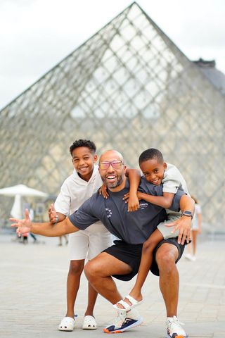 Charles Johnson (center) with his sonsCredit: Demetrious Williams