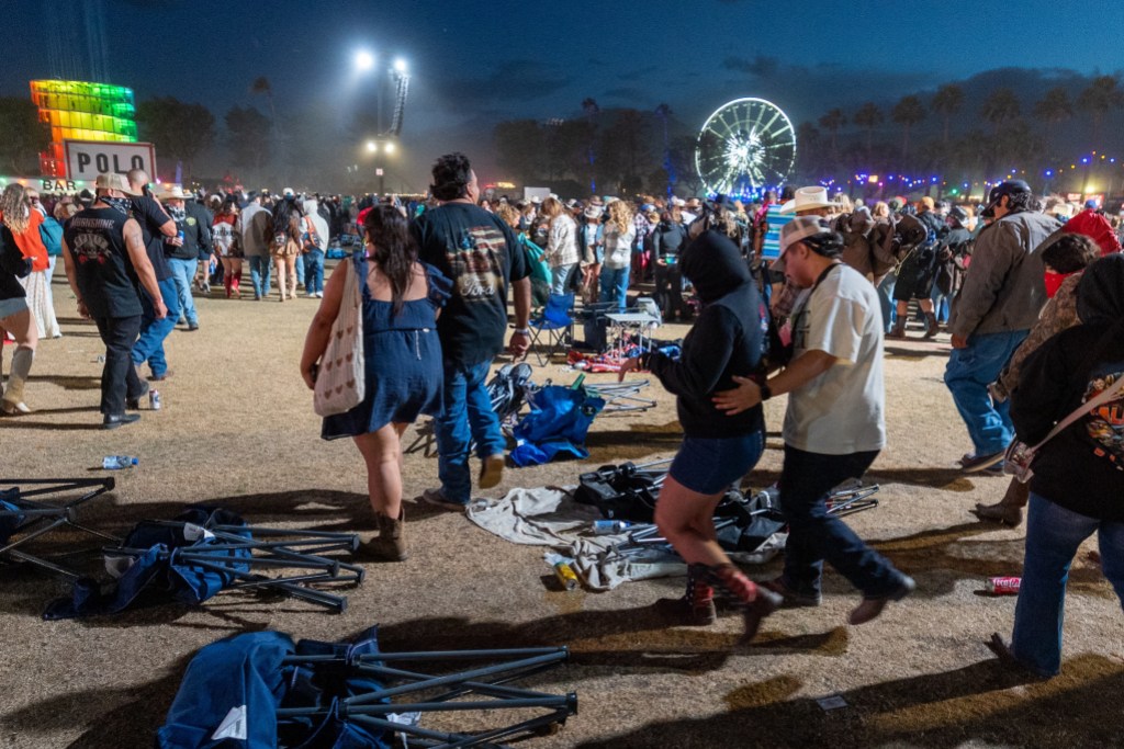 Indio, CA - April 25, 2026: Stagecoach festival goers evacuate the Mane Stage after announcements were broadcasted to evacuate the area due to extreme high wind gusts during the second day of the Stagecoach Country Music Festival at Empire Polo Club, in Indio, CA on Saturday, April 25, 2026. (Allen J. Schaben / Los Angeles Times via Getty Images)