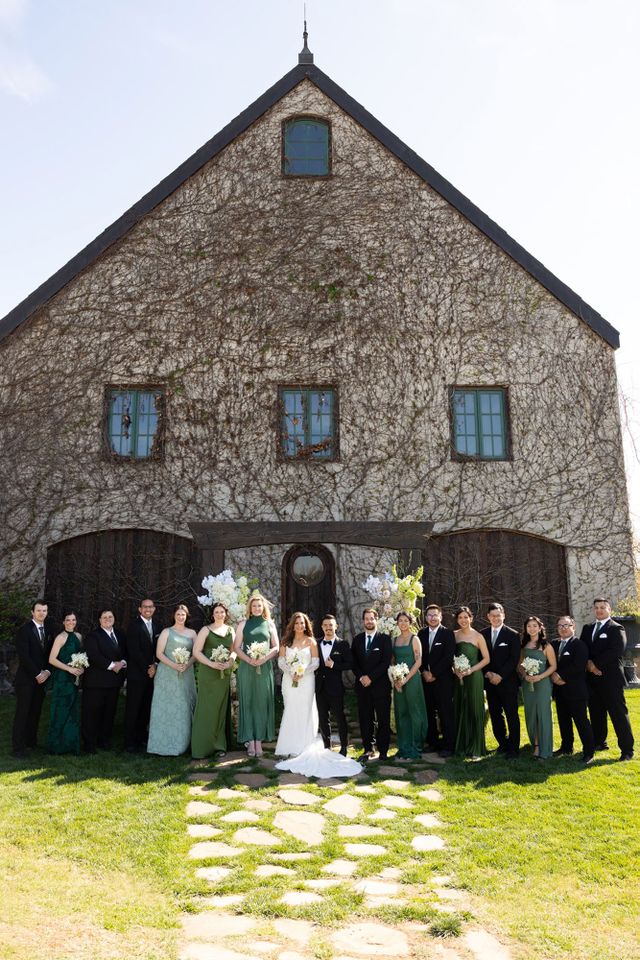 Lauren Berlingeri and Christopher Nguyen with their wedding party outside of The BaumberhofCredit: Leah Gunn