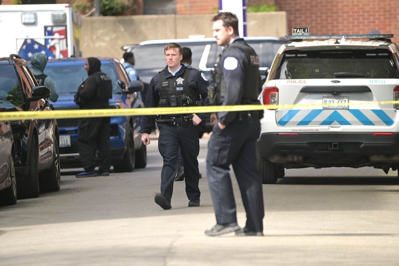 Chicago Police Department officers stand outside a hospital where two other officers were shotCredit: Jacek Boczarski/Anadolu via Getty