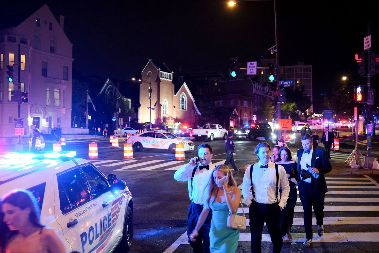 Guests walk away from the Washington Hilton amid a heavy police presence after shots were heard during the White House Correspondents' Dinner in Washington, DC, on April 25, 2026.Credit: Ulysse BELLIER / AFP via Getty