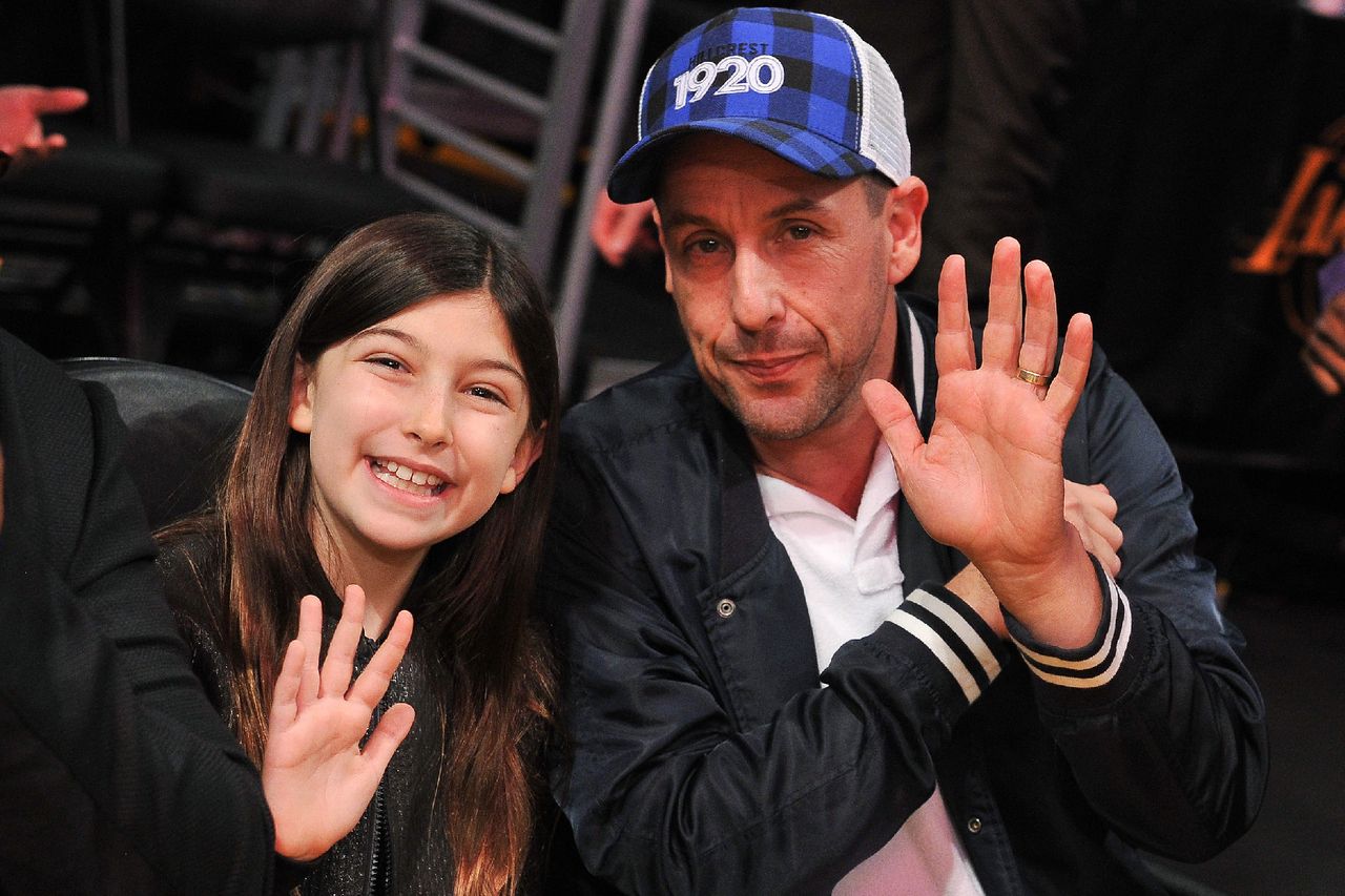 Adam Sandler and daughter Sunny Madeline Sandler attend a basketball game between the Los Angeles Lakers and the Portland Trail Blazers at Staples Center on November 14, 2018 in Los Angeles, California. Adam and Sunny Sandler at a Los Angeles Lakers game in 2018Credit: Allen Berezovsky/Getty