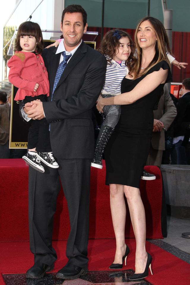 Actor Adam Sandler and his family pose for photographers during the installation ceremony for his star on the Hollywood Walk of Fame on February 1, 2011 in Hollywood, California. Adam, Jackie, Sadie and Sunny Sandler in 2011Credit: Frederick M. Brown/Getty