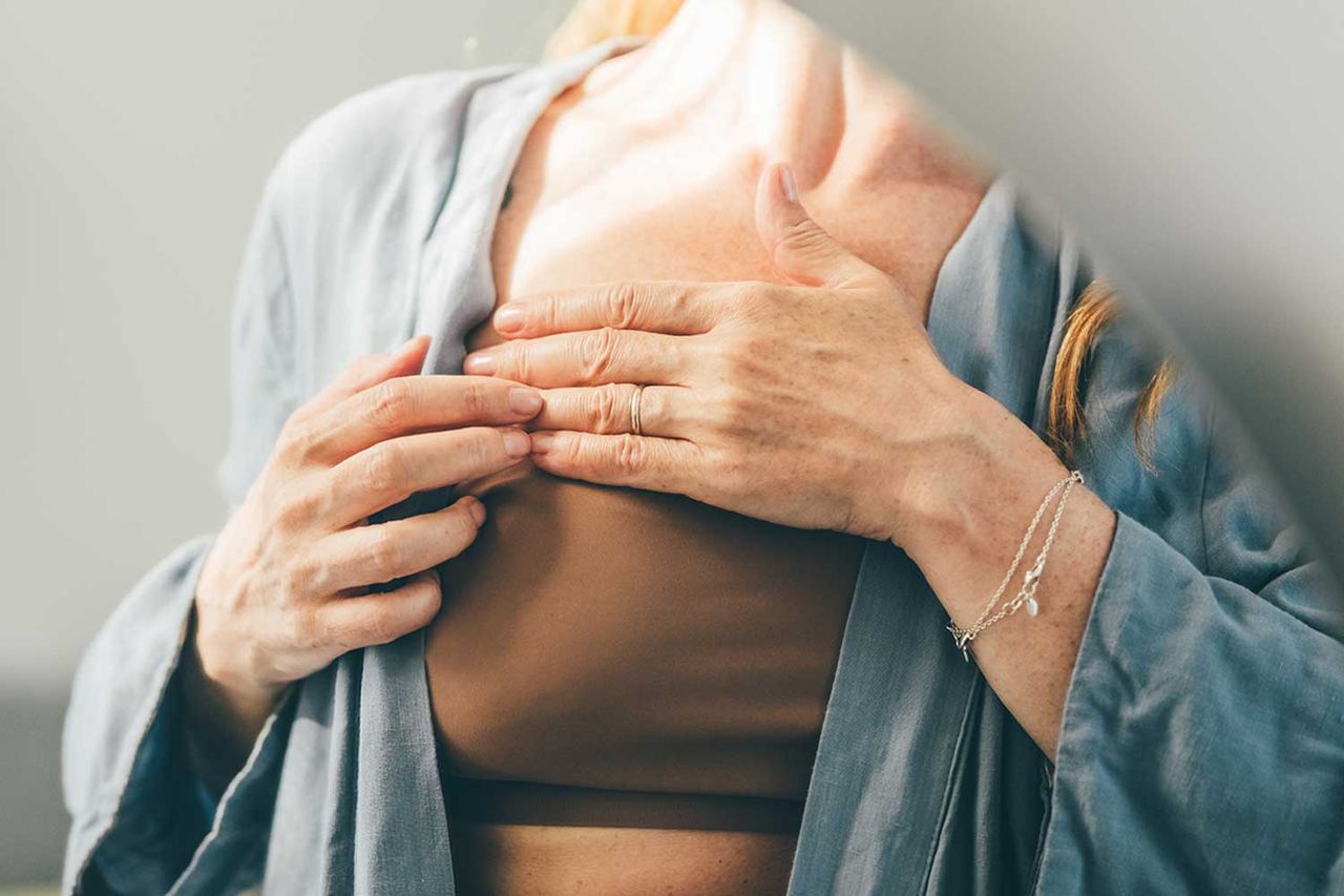 A woman checking her breast for cancer (stock image).Credit: Getty