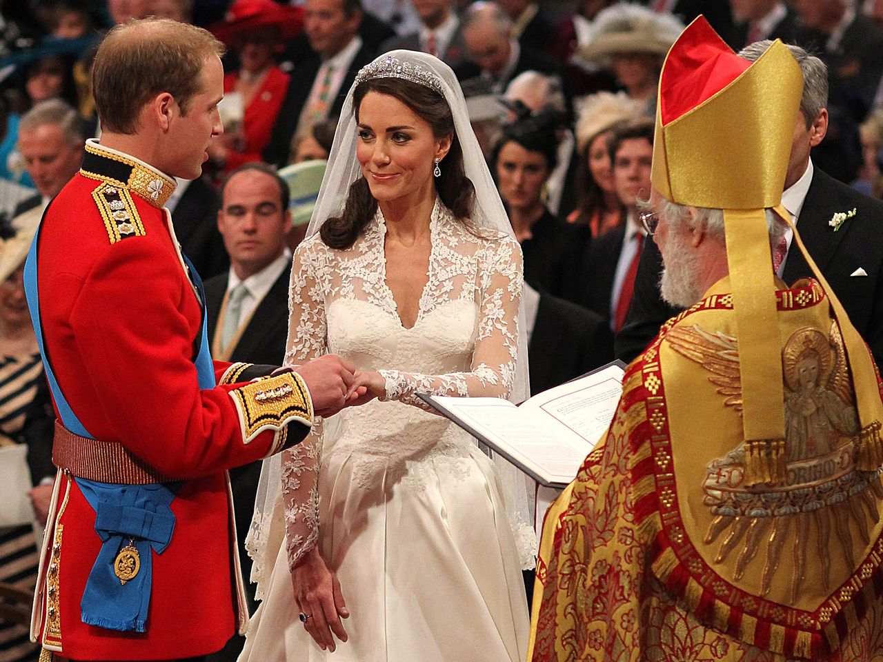 Prince William exchanges rings with his bride Catherine Middleton in front of the Archbishop of Canterbury Rowan Williams inside Westminster Abbey on April 29, 2011 in London, England.Credit: Dominic Lipinski - WPA Pool/Getty