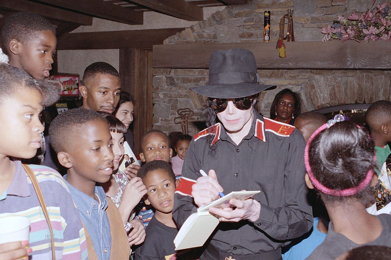 Michael Jackson signs autographs for guests at the Neverland Ranch on Saturday, Jan. 15, 1994, in Los Olivos, Calif.Credit: AP Photo