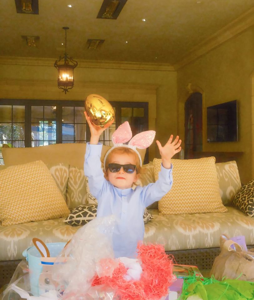 Paris Hilton Easter Bunny Pics with Her Kids Phoenix holds a golden egg aloftCredit: Paris Hilton/Instagram