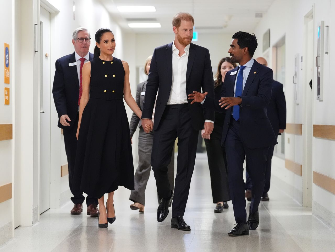 Meghan, Duchess of Sussex and Prince Harry, Duke of Sussex talk with Kog Ravindran, chief of staff to the CEO & executive director of communications at the Royal Children's Hospital, during a visit on April 14, 2026 in Melbourne, Australia. Meghan Markle and Prince Harry at the Royal Children's Hospital, MelbourneCredit: Jonathan Brady-Pool/Getty