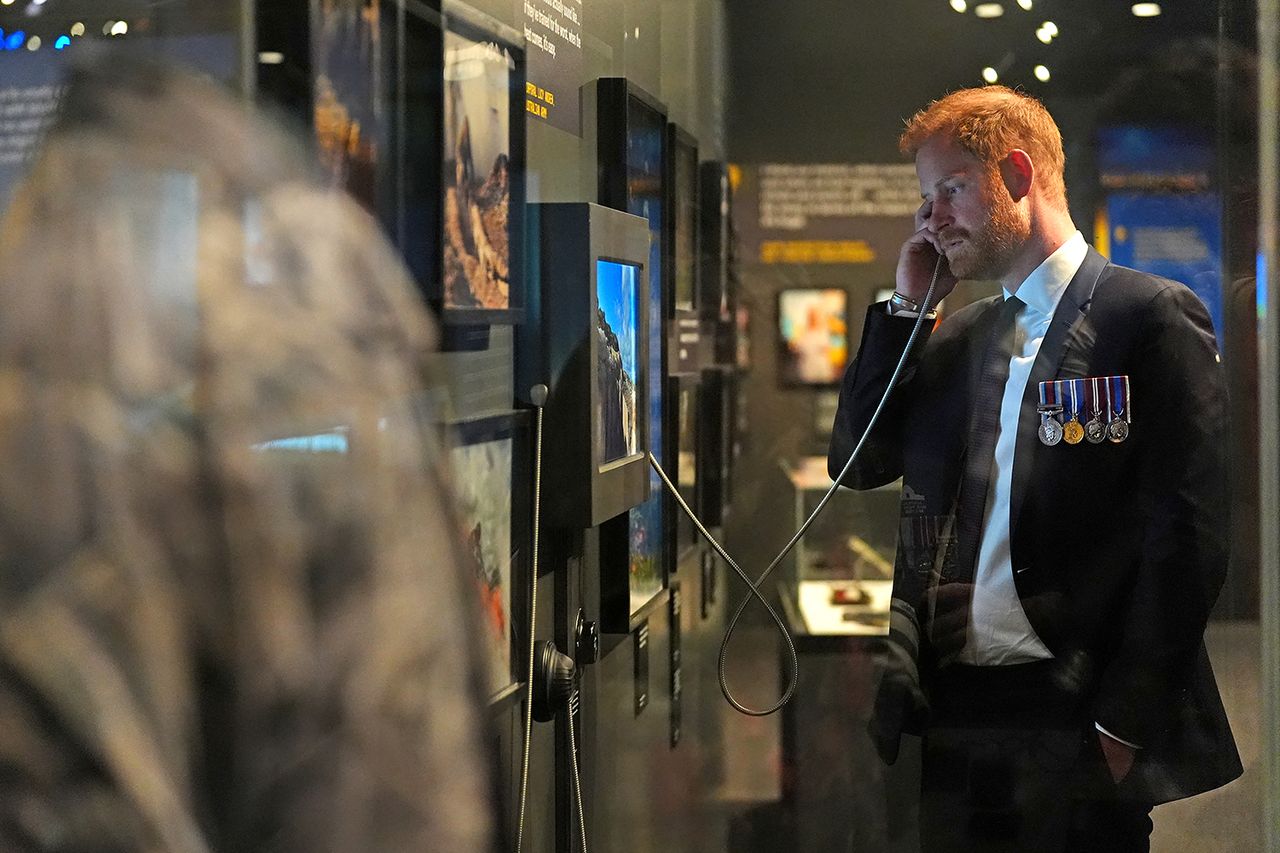 Britain's Prince Harry, the Duke of Sussex, engages with an interactive display in the Anzac Hall during a visit to the Australian War Memorial in Canberra Prince Harry at the Australian War MemorialCredit: Jonathan Brady / POOL / AFP via Getty