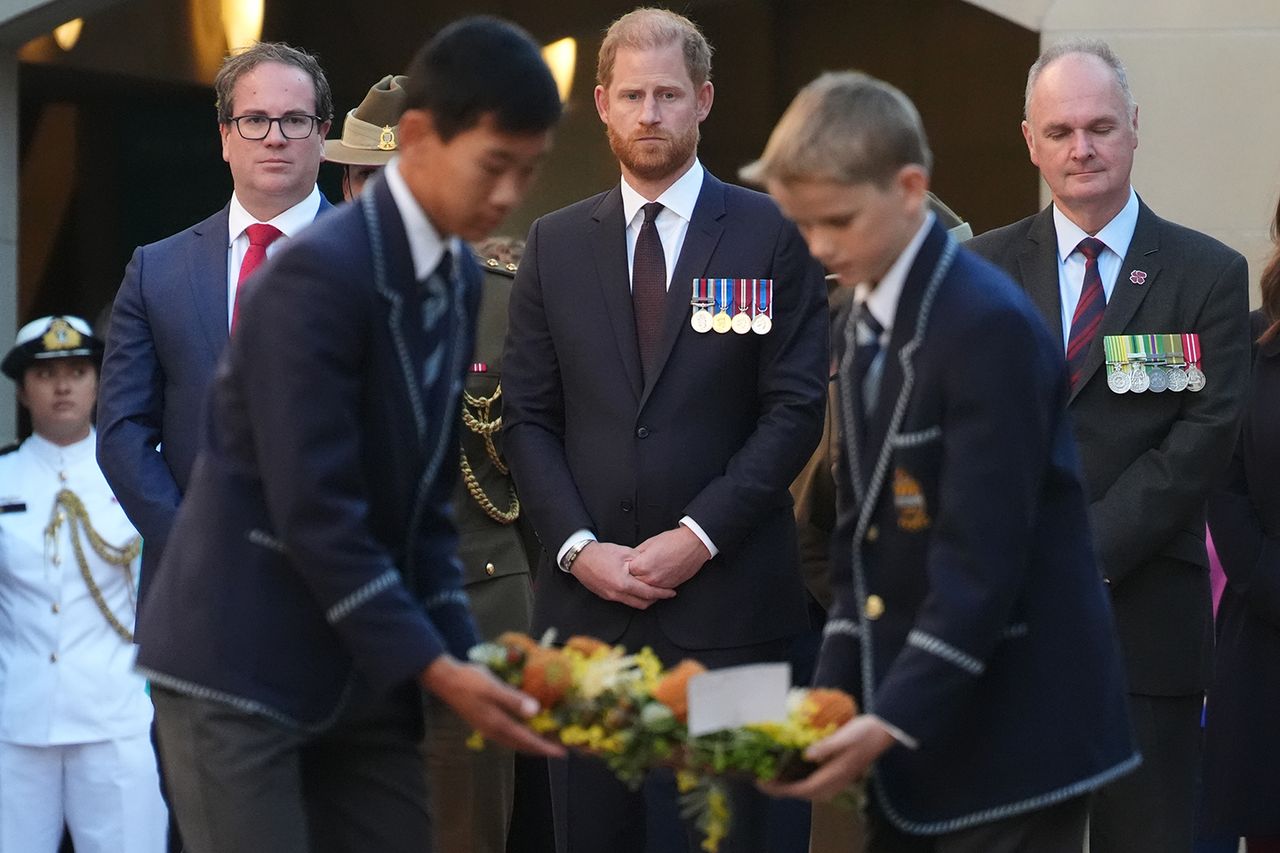 Prince Harry, Duke of Sussex observes wreath laying during the Last Post Ceremony the Australian War Memorial Prince Harry at the Australian War MemorialCredit: Jonathan Brady - Pool/Getty