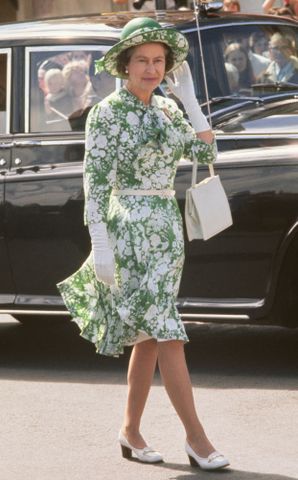 Queen Elizabeth wears a floral dress and hat during a walkabout in New Plymouth, New Zealand, during her Silver Jubilee tour on Feb. 25, 1977Credit: Serge Lemoine/Hulton Archive/Getty