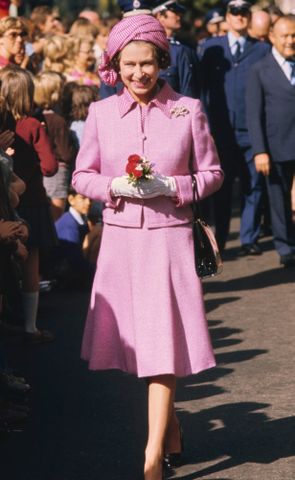 Queen Elizabeth wears a lilac suit and checkered turban-style hat during a walkabout in Wellington, New Zealand, during her Silver Jubilee tour on Feb. 27, 1977Credit: Serge Lemoine/Hulton Archive/Getty