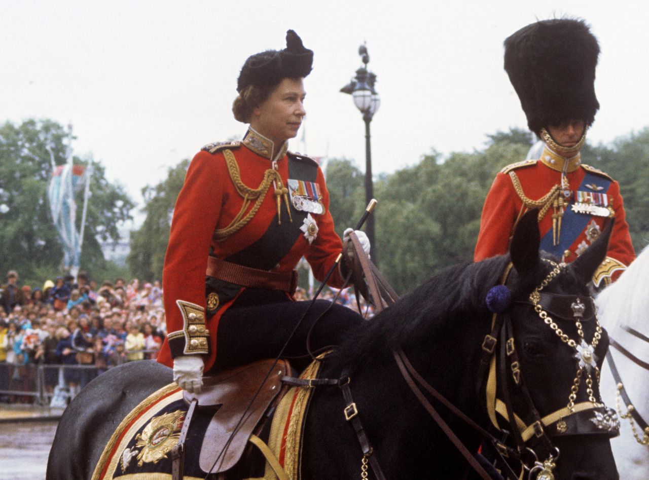 Queen Elizabeth sits atop a horse in the uniform of Colonel-in-Chief of the Scot Guards and Prince Philip during the Trooping the Colour ceremony in London in 1977Credit: PA Images via Getty