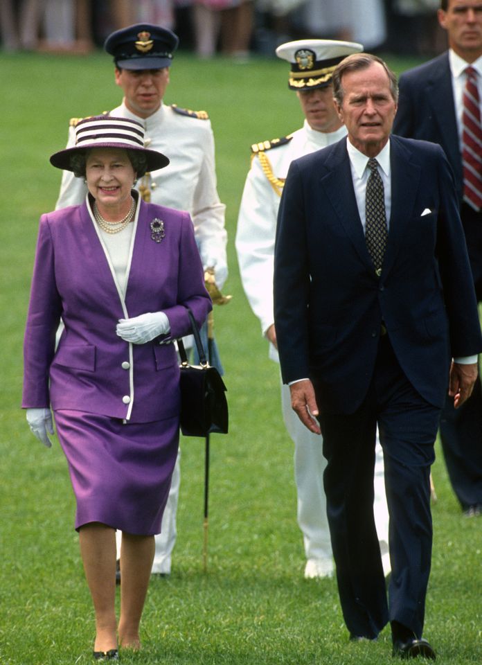 Queen Elizabeth and President George H.W. Bush walk on the South Lawn of the White House in Washington, D.C., on May 14, 1991Credit: Arnie Sachs/CNP/Getty