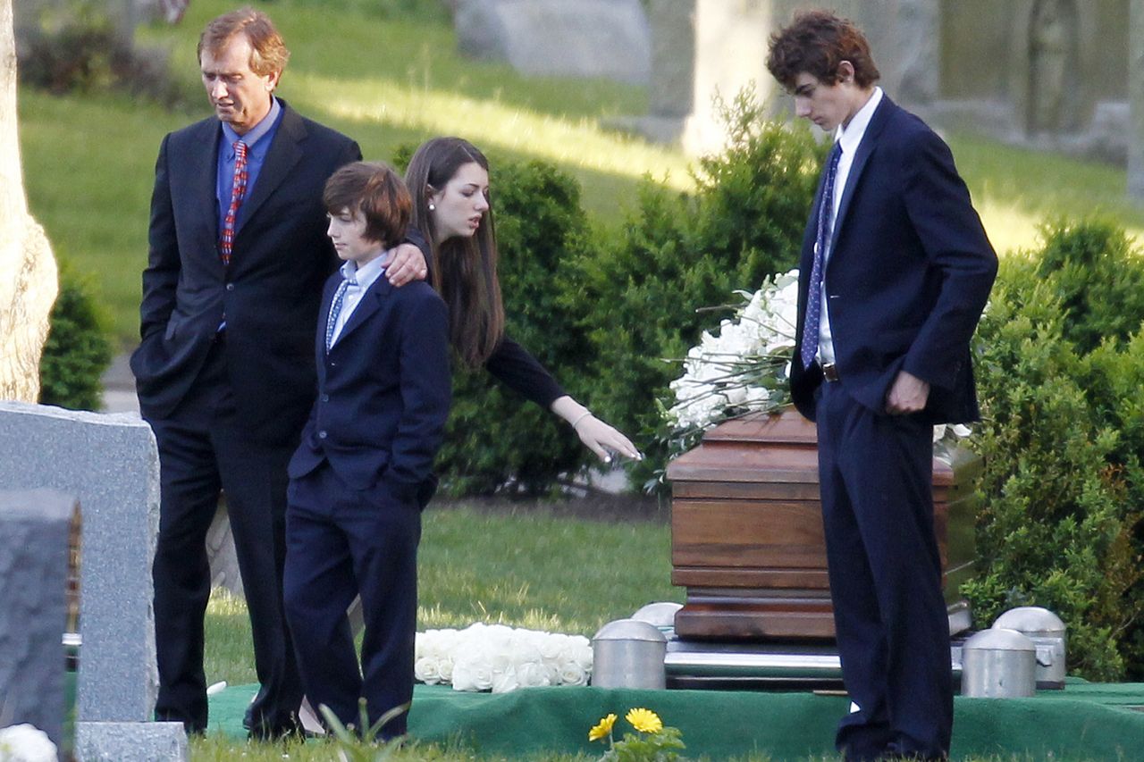Robert F. Kennedy Jr., left, and his children turn away after paying their respects at the casket of Mary Richardson Kennedy, in St. Francis Xavier Cemetery in Centerville, Mass., Saturday, May 19, 2012. Mary Richardson Kennedy was found dead of an apparent suicide last week at her home in Bedford, N.Y. Robert F. Kennedy Jr. and children pay respects at Mary Richardson Kennedy's casket on May 19, 2012Credit: AP Photo/Michael Dwyer