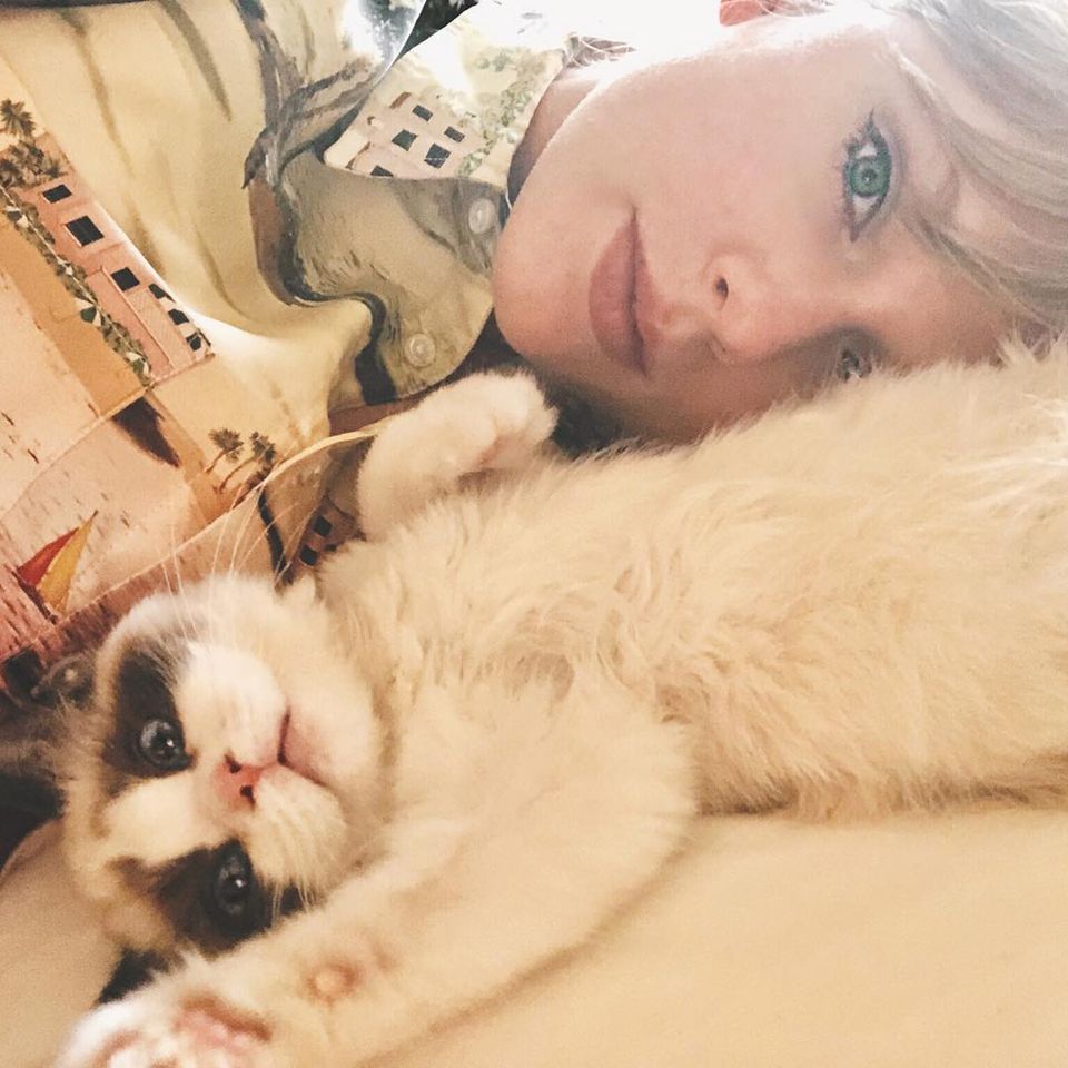 Taylor Swift and her cat Benjamin Taylor Swift lies next to her cat Benjamin ButtonCredit: Taylor Swift Instagram