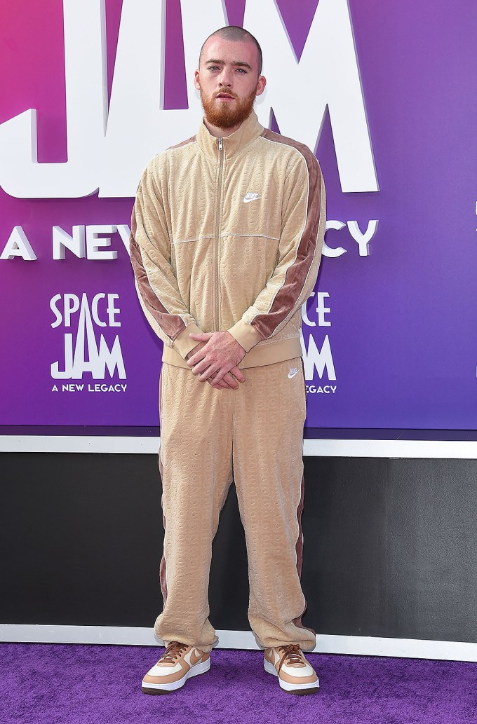 Angus Cloud in a tan tracksuit