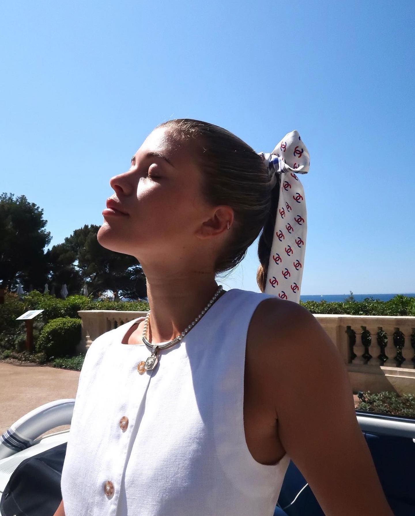 Sofia Richie wearing a Chanel hair scarf.