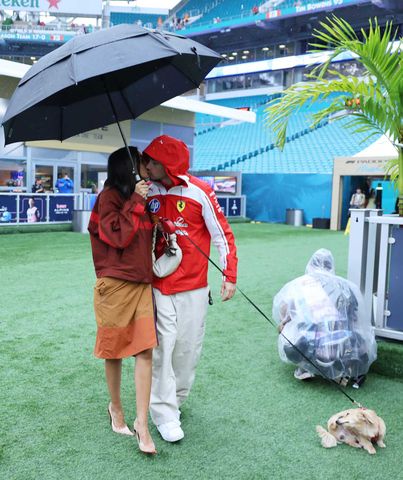 Charles and Alexandra Leclerc kiss in the paddock ahead of the 2026 Miami Grand Prix.Credit: Hector Vivas - Formula 1/Formula 1 via Getty