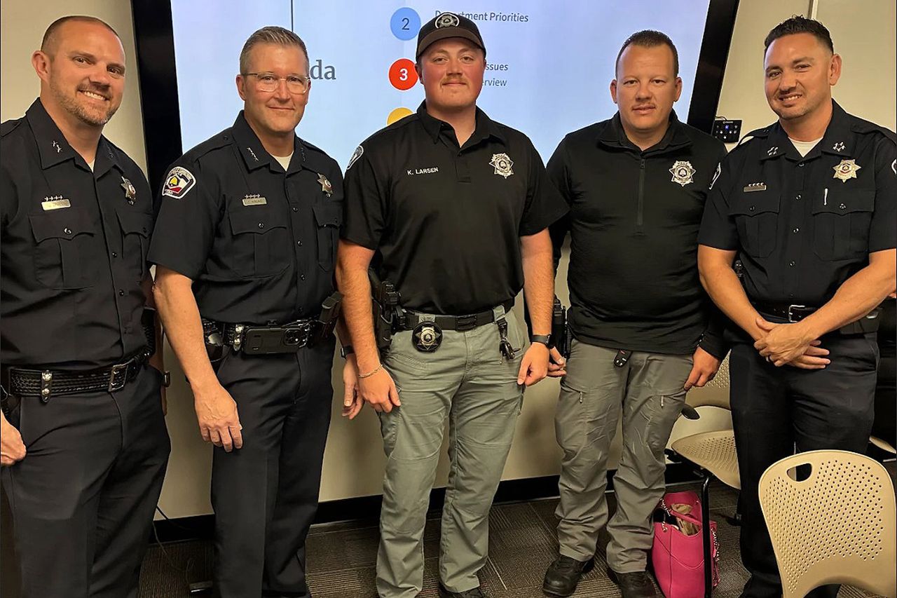 Utah officials, including Department of Corrections patrol officers Nick Parker and Kelten LarsenCredit: Utah Department of Corrections/Facebook