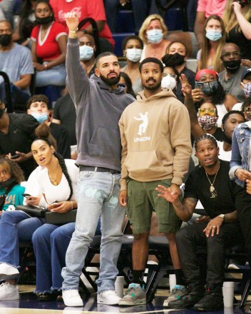 Chatsworth, CA  - Drake & Michael B Jordan step out to support Bronny James, Amari Bailey & the Sierra Canyon Varsity Basketball squad play their last basketball game of the season. Drake shows a lot of emotion during the game; smiling, yelling frantically at the refs and cheering his boys as they fall short to be eliminated from the regional playoffs. Interestingly enough Drake made his feeling known in the form of fashion as he donned jeans with 'Fuck You' printed near his crotch. At the end of the game, he shows love to Amari Bailey who had a stellar season.Pictured: Drake, Michael B. Jordan, Bronny James, Amari Bailey, Savannah JamesBACKGRID USA 17 JUNE 2021 BYLINE MUST READ: ShotbyNYP / BACKGRIDUSA: +1 310 798 9111 / usasales@backgrid.comUK: +44 208 344 2007 / uksales@backgrid.com*UK Clients - Pictures Containing ChildrenPlease Pixelate Face Prior To Publication*
