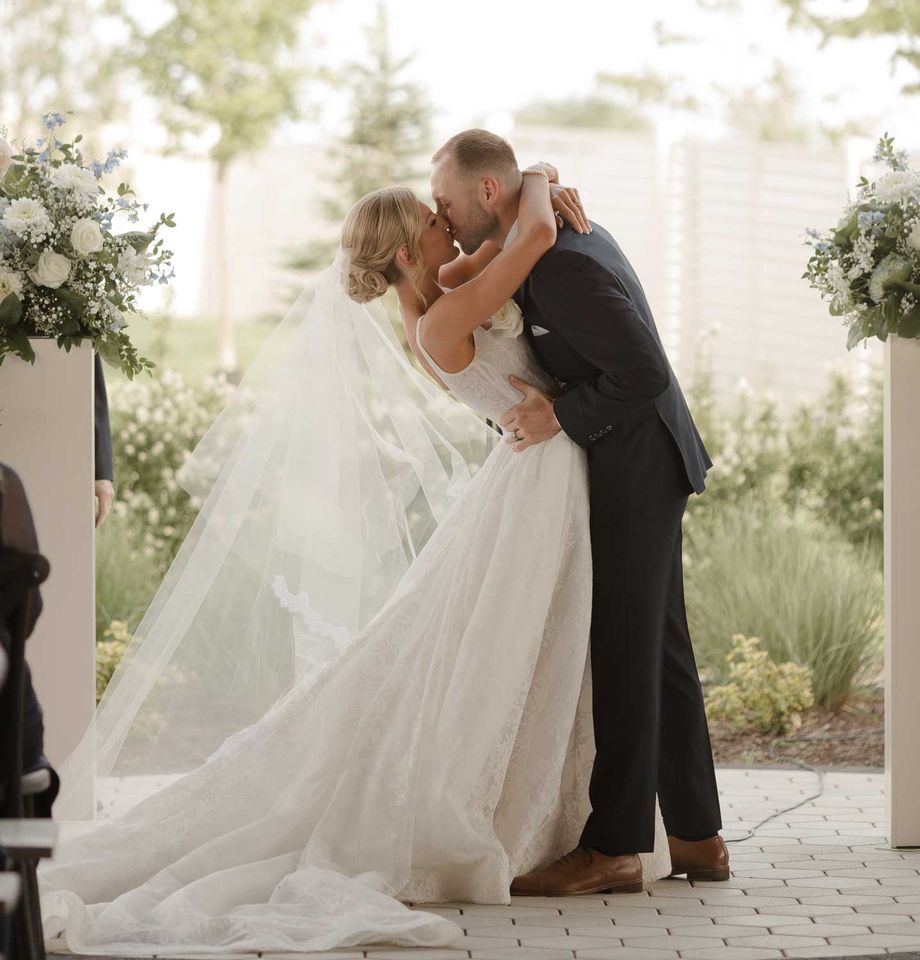 Dallas Cowboys Cheerleader Kennedy Hannan Marries Nolan Ruff Kennedy Hannan and Nolan Ruff kissing during their wedding ceremonyCredit: Ivory+Bliss