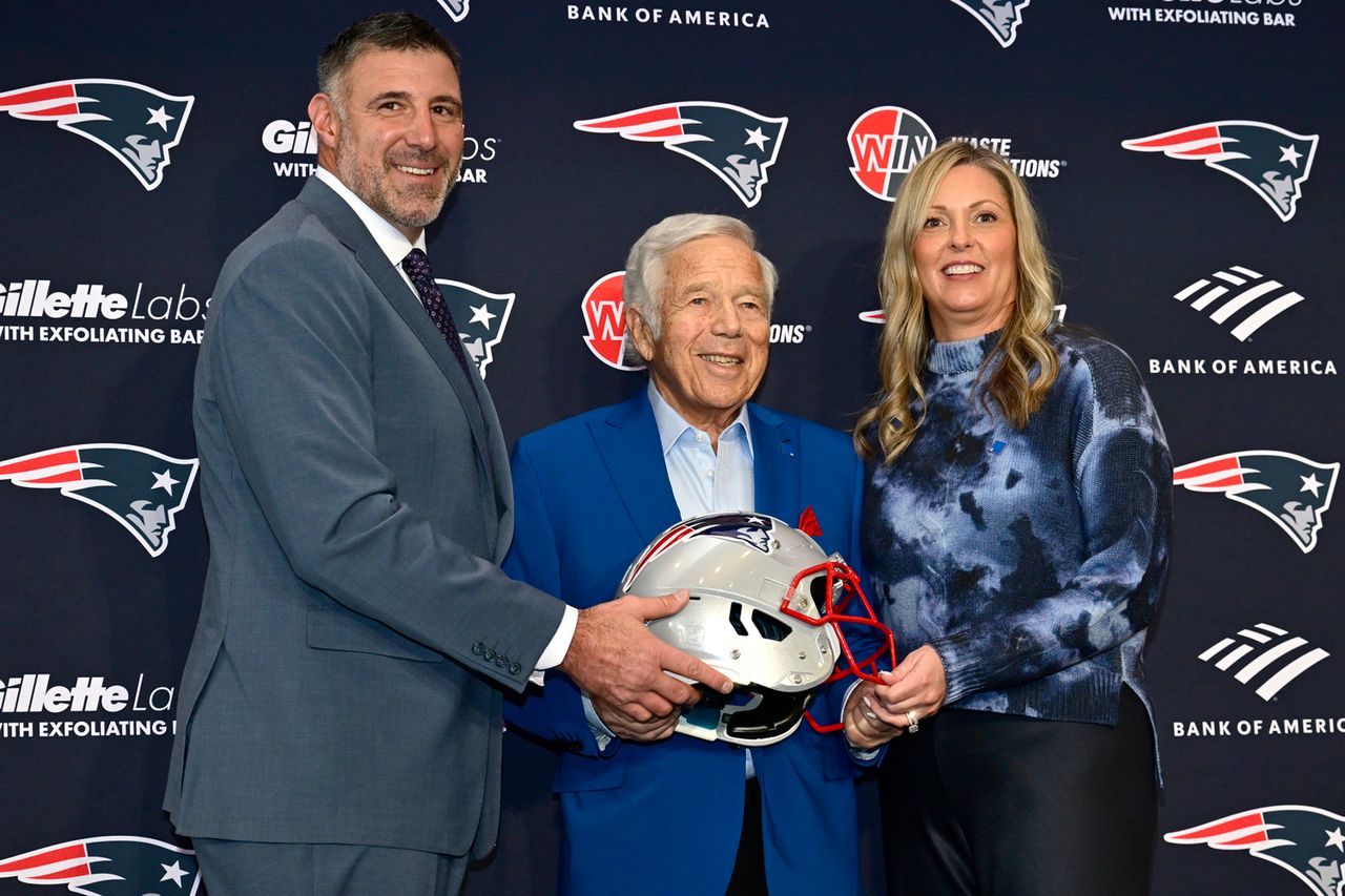 Robert Kraft with Mike Vrabel and his wife Jen as Mike is announced as head coach of the New England Patriots on January 13, 2025 in Foxborough, Massachusetts.Credit: Billie Weiss/Getty