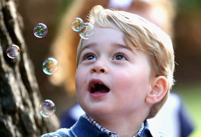 Prince George plays with bubbles