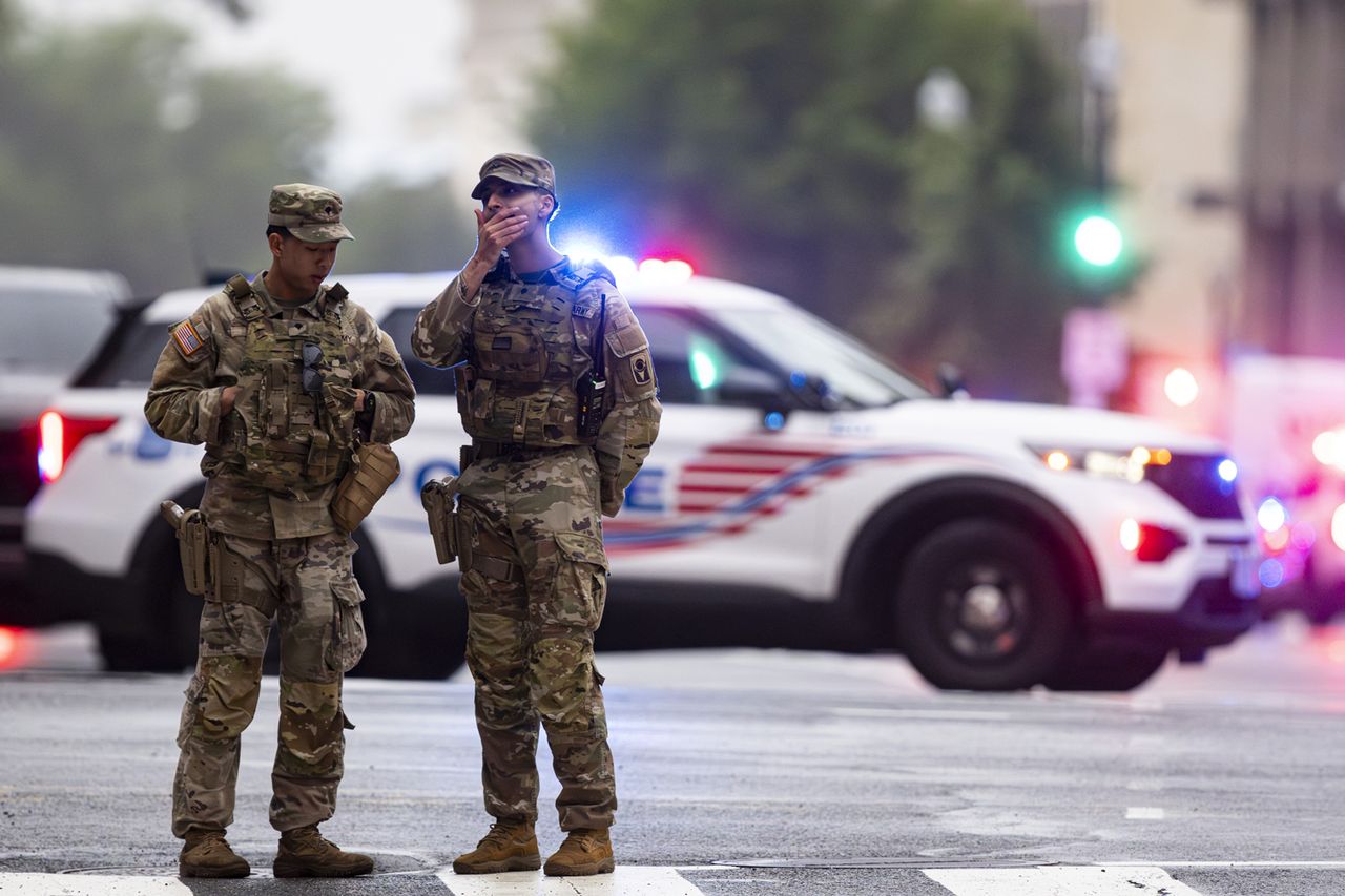 The U.S. National Guard stand guard outside the White House after gunshots fired on May 23 in Washington, DC.Credit: Al Drago/Getty