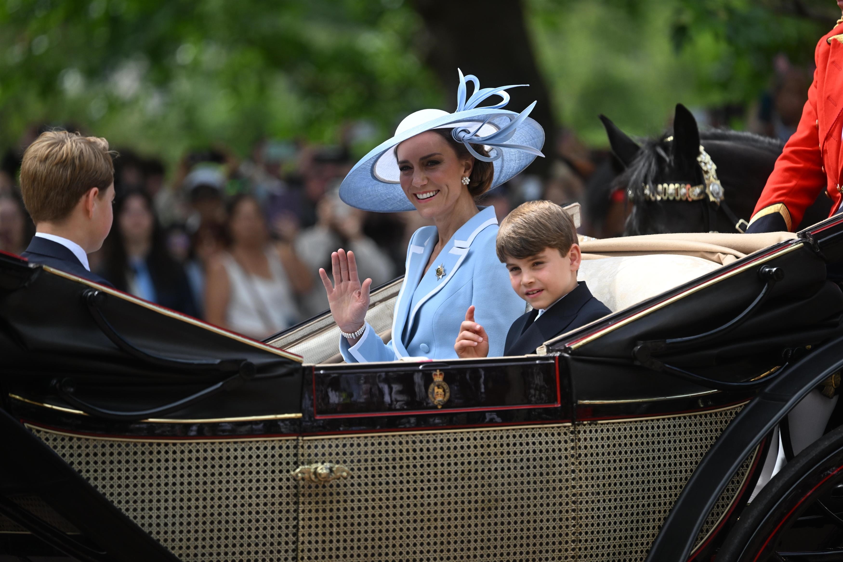 Catherine, Princess of Wales and Prince Louis wave during the Trooping the Colour parade.