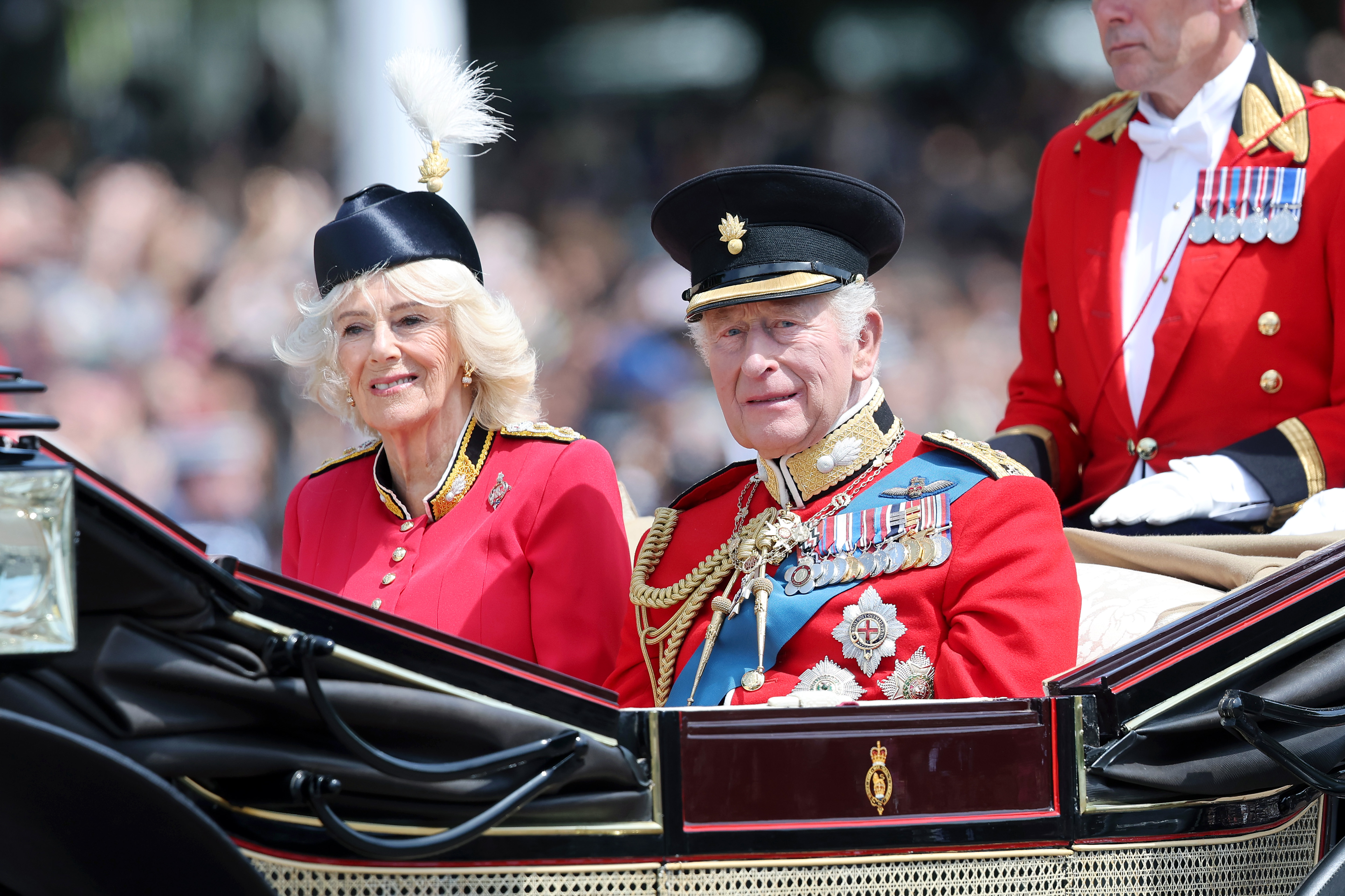 Queen Camilla and King Charles III pass through the Trooping The Colour parade.