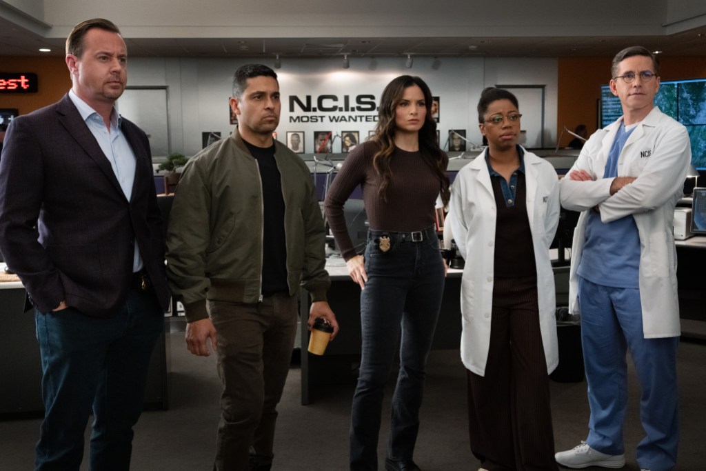 “DEAL WITH THE DEVIL” - CBS Original Series NCIS, scheduled to air TUESDAY, MAY 5 (8:00 PM ET/PT)  Pictured (L-R): Sean Murray as Timothy McGee, Wilmer Valderrama as Nick Torres, Katrina Law as Jessica Knight, Brian Dietzen as Jimmy Palmer and Diona Reasonover as Kasie Hines.  Photo: Robert Voets/CBS  ©2026 CBS Broadcasting, Inc. All Rights Reserved.