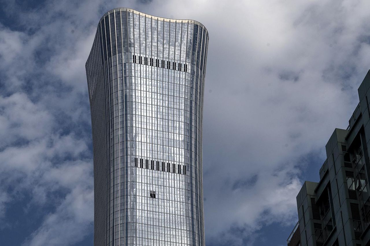 Two glass panel on CITIC Tower appear damaged following reports of a plane crash in Beijing on June 26Credit: Kevin Frayer/Getty