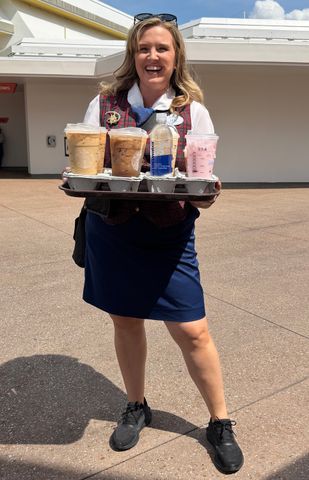 Dickson's VIP tour guide, Lexi, comes prepared with drinks after delivers coffee orders after the group got off a ride.Credit: Courtesy of Kelly Dickson