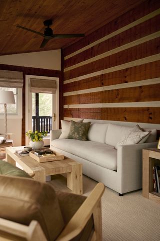 George Kittle and Wife Claire Show Off Their Newly Renovated Nashville Cabin Union sofa in the sunroomCredit: Pottery Barn