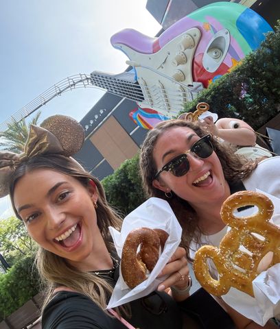 Kelly Dickson (L) enjoys a pretzel during her VIP tour at Disney's Hollywood Studios.Credit: Courtesy of Kelly Dickson