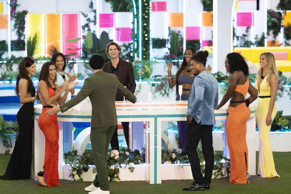 LOVE ISLAND USA -- Episode 801 -- Pictured: (l-r) Ariana Madix, Beatriz Alexa Hatz, Melanie Moreno, Bryce Alakai Dettloff, Trinity Celeste Tatum, Sincere Nicholas Rhea, Aniya Harvey, Mackenzie "Kenzie" Brooke Annis -- (Photo by: Ben Symons/Peacock)