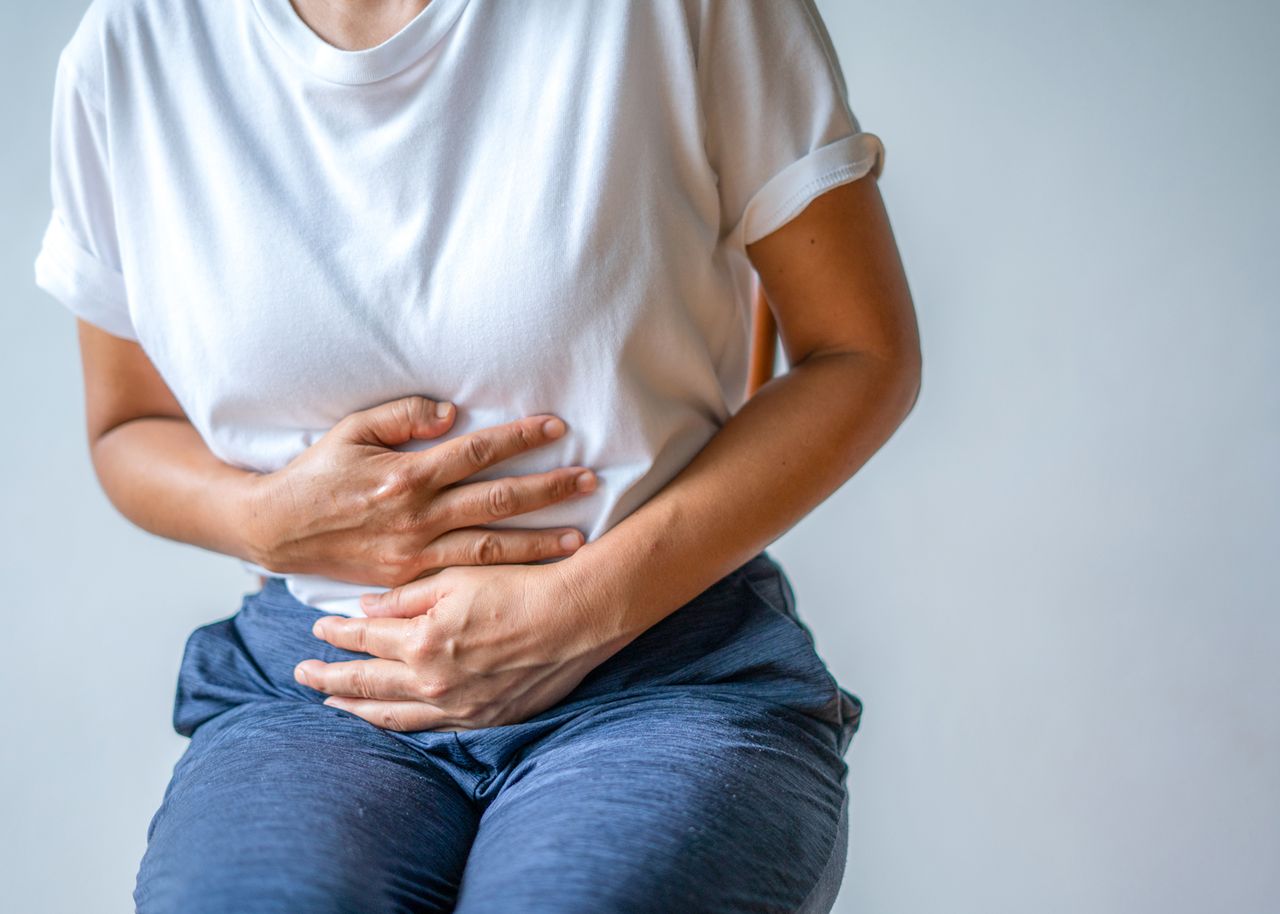 Stock image of a woman with a stomach acheCredit: Getty