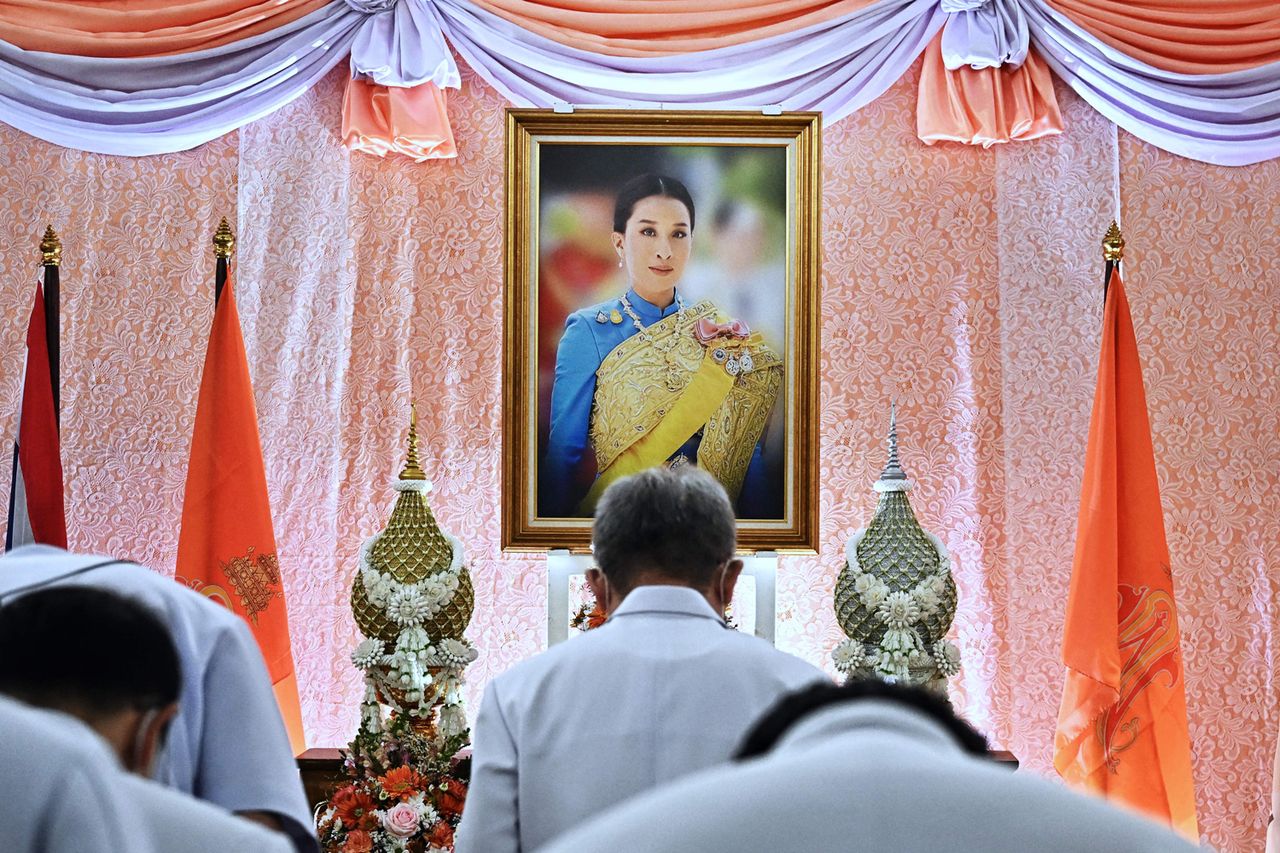 Well-wishers bow in front of an image of Thailand's Princess Bajrakitiyabha Mahidol, at Chulalongkorn Hospital in Bangkok on December 16, 2022. A portrait of Princess Bajrakitiyabha Mahidol in December 2022Credit: LILLIAN SUWANRUMPHA/AFP via Getty