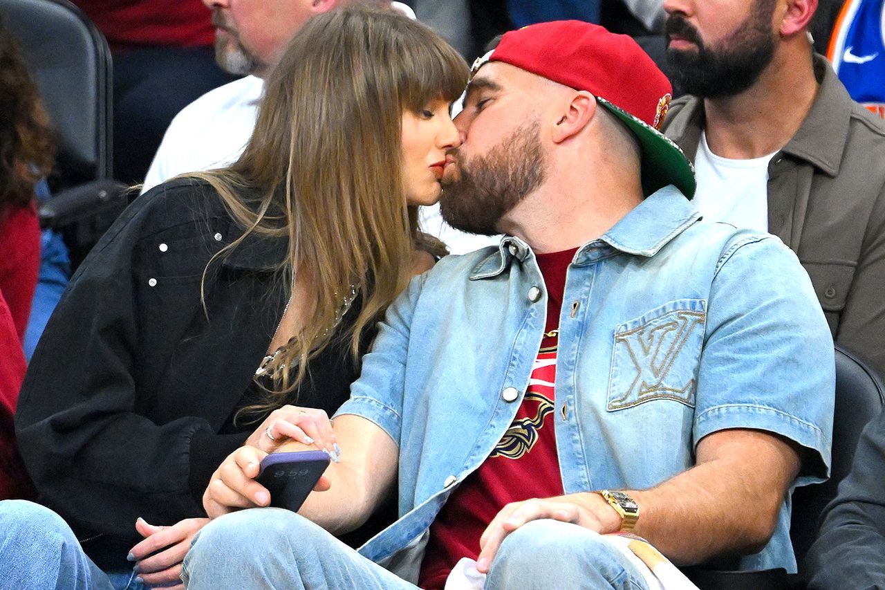 Taylor Swift and Travis Kelce kiss during Game Three of the NBA Eastern Conference Finals on May 23, 2026 in Cleveland, Ohio.Credit: Jason Miller/Getty
