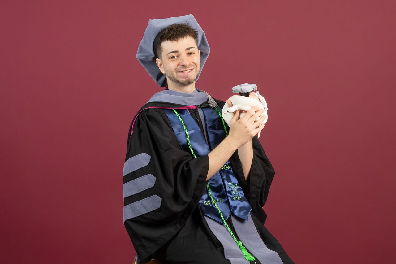 he Virginia-Maryland College of Veterinary Medicine Class of 2026 in their commencement regalia with their pets. Noah Goldfarb with his snakeCredit: Madison Brown/Virginia Tech