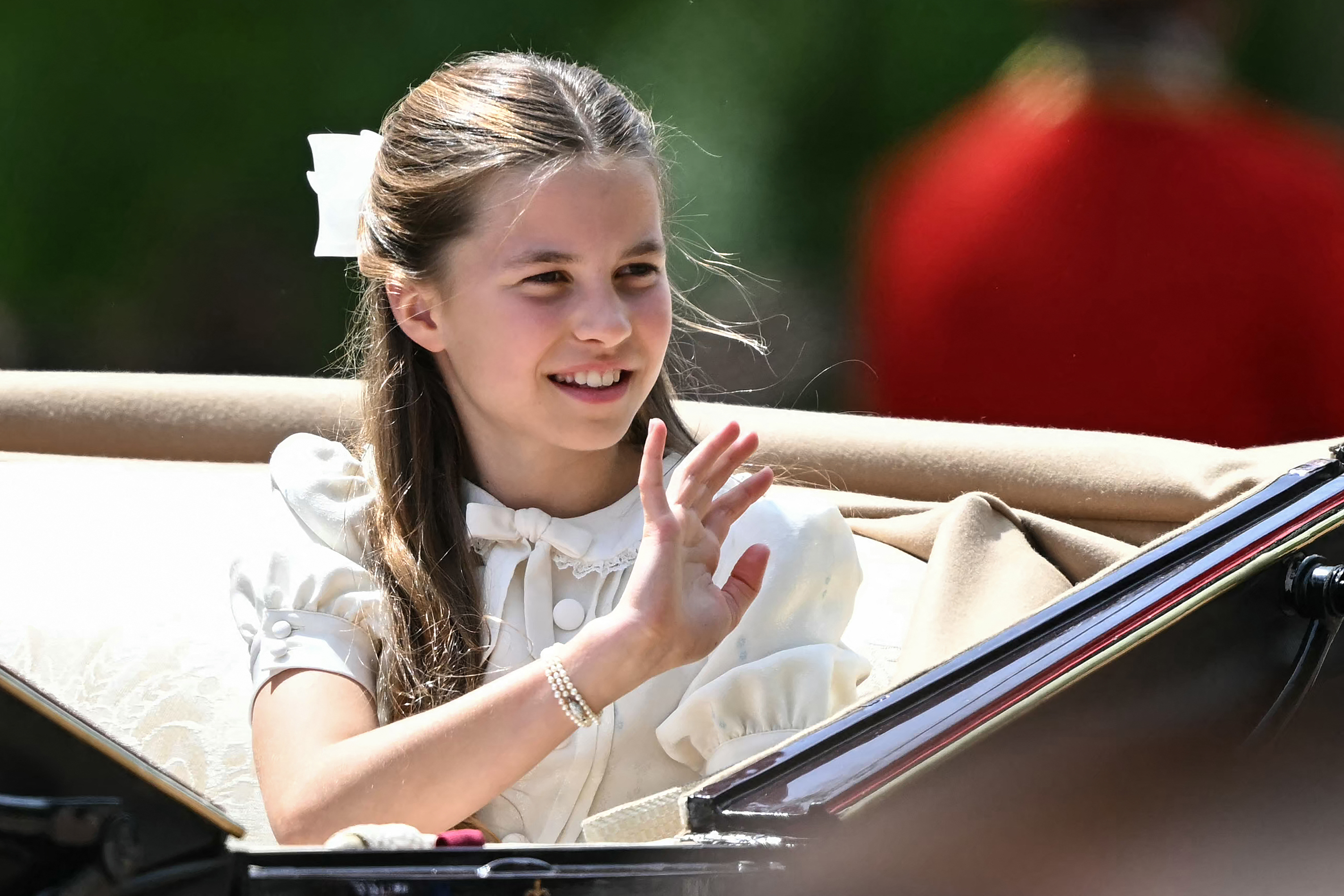 Princess Charlotte of Wales waves during the Trooping the Colour parade.