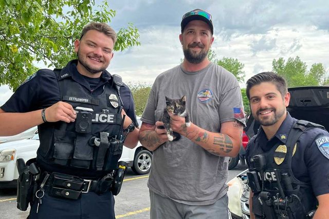 Cat Gets Suck in Vehicle A photo of the rescued kitten with two Seneca Falls Police officers and Chris Knapp from Stever's GarageCredit: Town of Seneca Falls Police Department