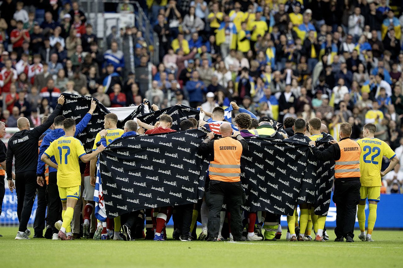 Staff and players from Denmark and Ukraine surround Christian Eriksen following his collapse on June 7, 2026Credit: Bo Amstrup / Ritzau Scanpix / AFP via Getty