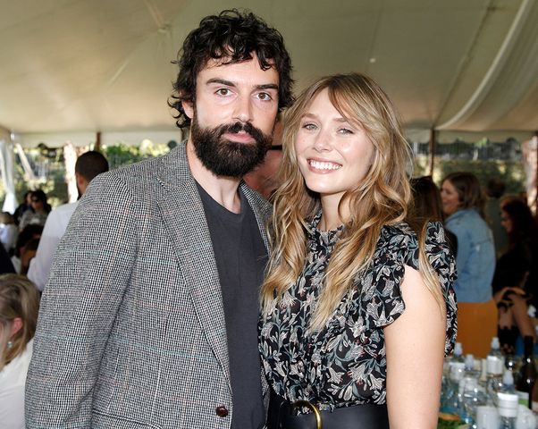 Robbie Arnett and Elizabeth Olsen attend the Rape Foundation Annual Brunch 2019 at a Beverly Hills Private Estate on October 06, 2019 in Beverly Hills, California. Robbie Arnett and Elizabeth Olsen in 2019.Credit: Tibrina Hobson/Getty