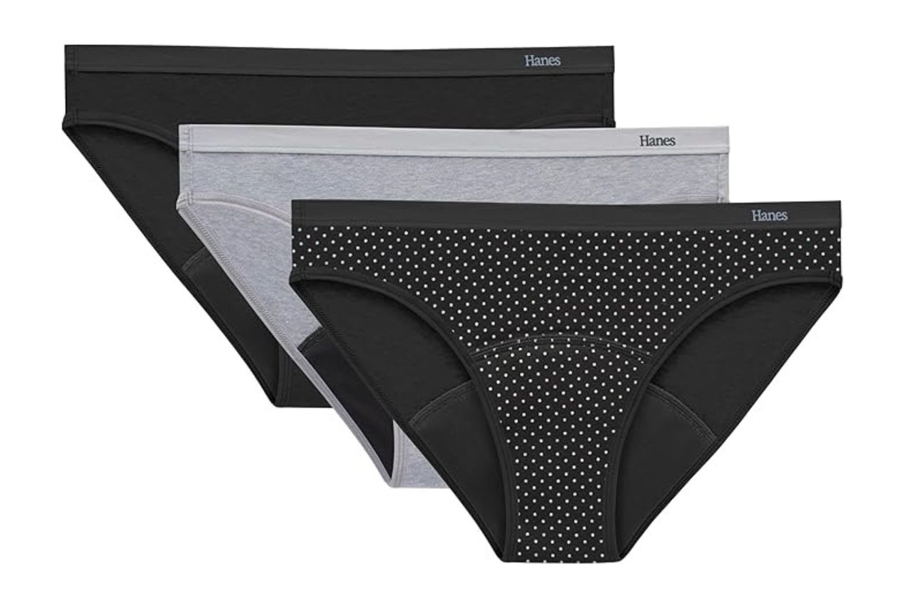 Three pairs of Hanes underwear displayed overlapping in a fan arrangement showcasing solid and polka dot patterns Credit: Amazon