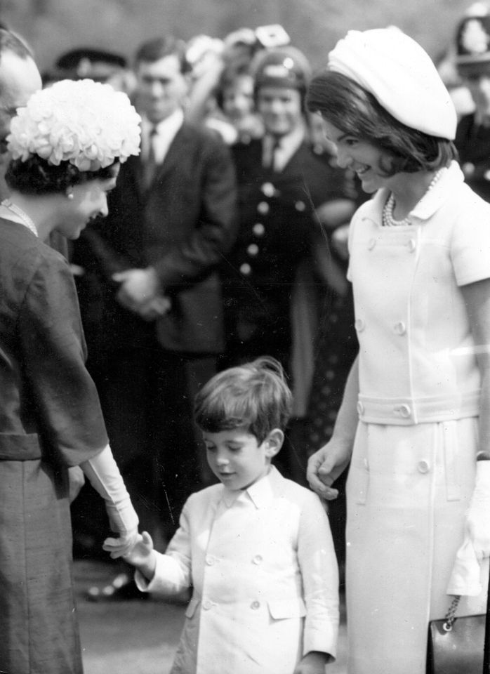Queen Elizabeth II of Great Britain with John Kennedy Jr. (1960 - 1999), son of the late President John F Kennedy, and Jackie Kennedy during the inauguration of Britain's Kennedy memorial at Runnymede. Queen Elizabeth, John F. Kennedy Jr. and Jackie Kennedy at the Runnymede memorial honoring President Kennedy in 1965.Credit: Wesley/Keystone/Getty
